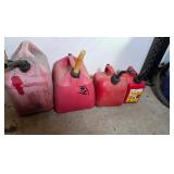4 gas cans, 5, 3?, 2, and 1 gallon