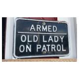 ARMED OLD LADY ON PATROL METAL SIGN