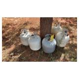 (5) 20LB PROPANE TANKS (2) FULL AND (3) HALF FULL