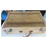 SUIT CASE W/ OLD NEWS PAPERS