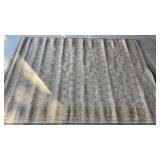 BROWN RUG MEASURES 87 x 63"