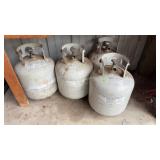 4-20lb propane bottles, 2-appear to be full