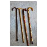 4 Wooden Canes. Some Carved / Painted.