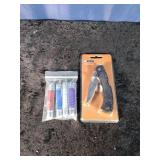 Ozark Trail Pocket knife and 4 Small Pocket knives