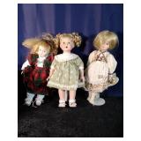 3 Various 16" tall Porcelain Dolls