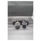 4 Black Ceramic Kitchen Cannisters and 1 Glass