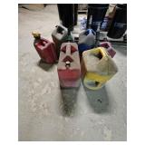 6 Used Plastic Fluid Cans.