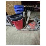 Trash cans, chairs and a floor sweeper