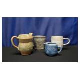 4 ceramic pottery Mugs and Creamers