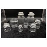 Six Glass Canisters and Two Glass Jars