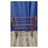 Wood Quilt Rack With Cherry Finish.