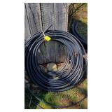 Large Roll Of 1/2" Black Pipe.