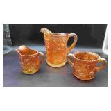 Open Rose Marigold. Orange Carnival Glass Pitcher.