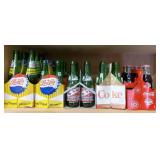Shelf Of 7 UP & Coca Cola Bottles