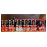 Shelf Of Coca Cola Bottles