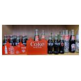 Shelf Of Coca Cola & Misc Soda Bottles