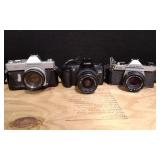 Three 35MM Cameras.