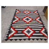 Navajo rug been patched-83x59