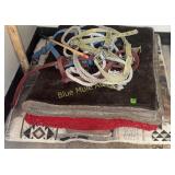 4 saddle pads, 3 halters, 1 whip