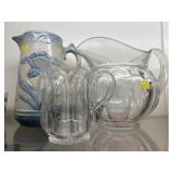 Stoneware with 2 Heisey Glass Pitchers