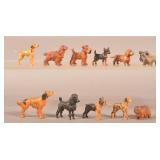 Lot of 11 Antique Miniature Carved Dog Figures.