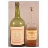 Two Paper-Labeled Whiskey Bottles.