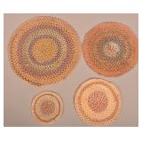 Four Round Multi-Colored Braided Table Mats.