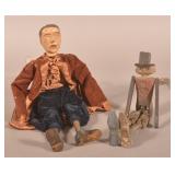 Two Folk Art Carved Wood Paint-Decorated Dolls.