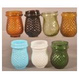 Seven Colored Glass Christmas Candle Cups.