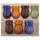 Seven Colored Glass Christmas Candle Cups.