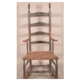 Distinctive Scrolled-Arm Woven Seat Rocker.