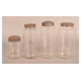 Four Early Graduated Glass Apothecary Jars.
