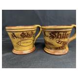 (2) C.M. Foltz Redware Mugs