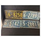 (4) Wyoming License Plates