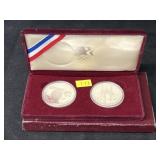 (2) Olympic Silver Dollars