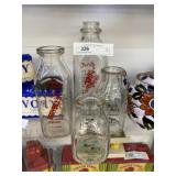 (4) Assorted Milk Bottles