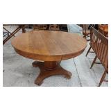 48" SOLID OAK DINING TABLE..