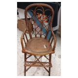 OLD WICKER HIGH CHAIR..