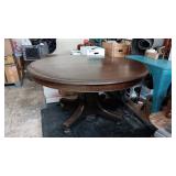 54' ROUND OAK DINING TABLE..