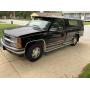 Black 1996 Chevy model K 1500 With topper.