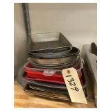 Stack of Assorted Baking Pans - Pizza Pan