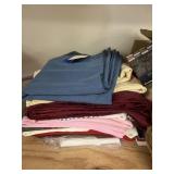 Pile of Assorted Table Cloths
