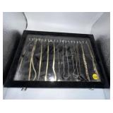 Assorted Gold Toned Necklaces in Display Case