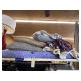 Pile of Assorted Pillows & Throw Blanket