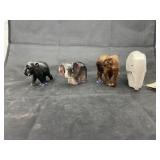 4 assorted elephant figurines
