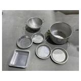 Pile of aluminum bakeware and stockpot