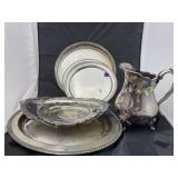 7 pcs. of silver toned serving trays & pitcher