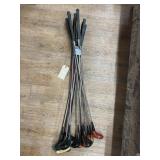 Pile of vintage golf clubs