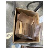 Box of walnut wood pieces