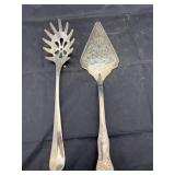 2 silver toned serving utensils